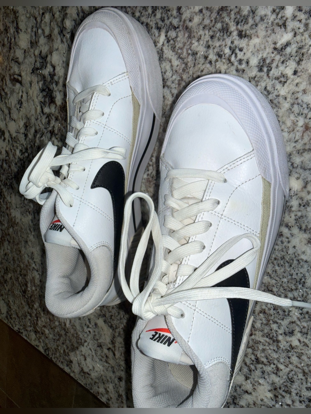 Nike White Sneakers with Black Swoosh